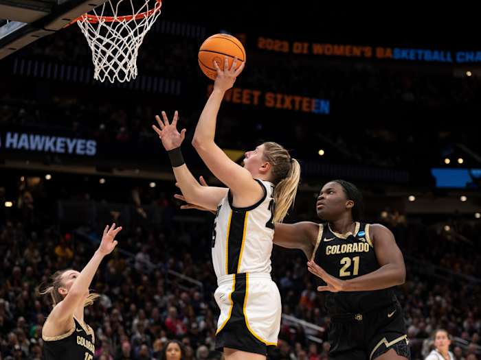 Iowa forward Monika Czinano shoots over Colorado guard Kindyll Wetta and center Aaronette Vonleh during the Sweet 16 of the NCAA women’s tournament.